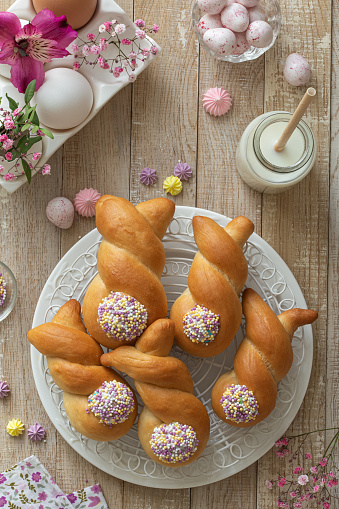 Funny bunny buns rolls. Easter bake idea. Flat lay, top view, wooden background