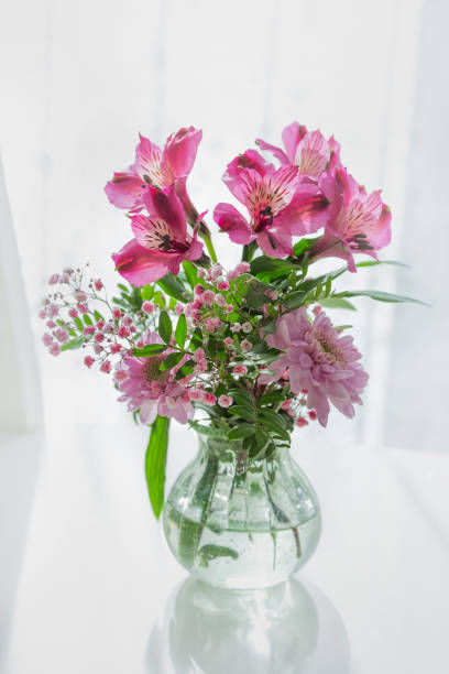 istock Vase with pink spring flowers 1465954314