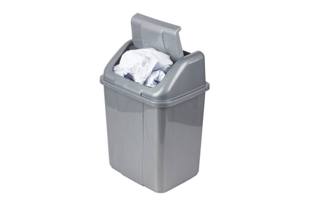 istock gray trash can full of crumpled paper isolate, no background 1465955815