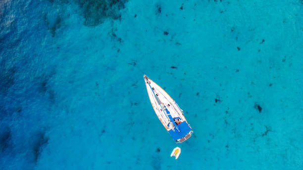 istock Sailboat near beautiful beach in Greece 1465960108