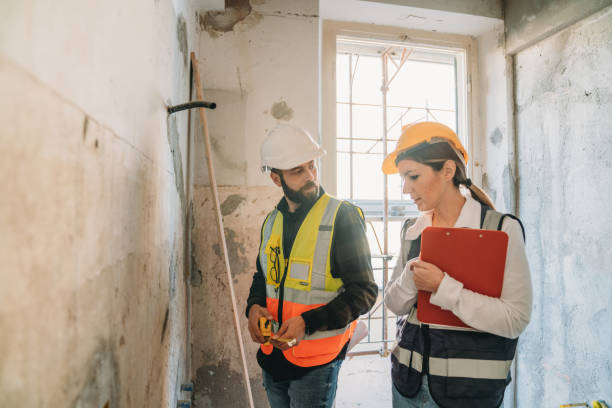 istock A man and a woman are working together in a construction site 1465964120