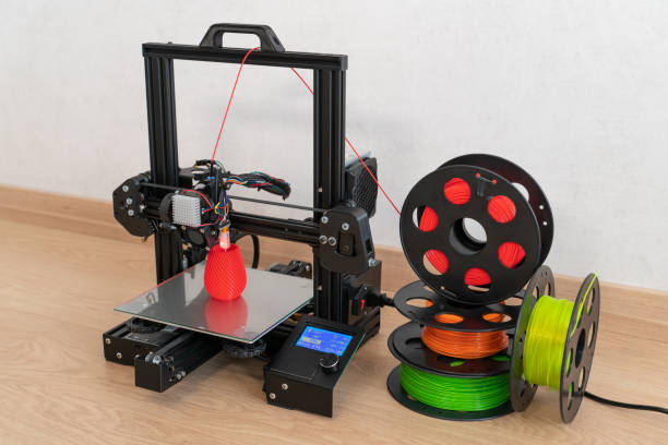 modern 3d printer and multi-colored filament spools - printout industry printer workshop imagens e fotografias de stock