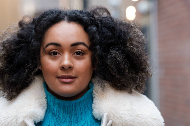 istock Head-shot of curly chubby woman. 1465987518