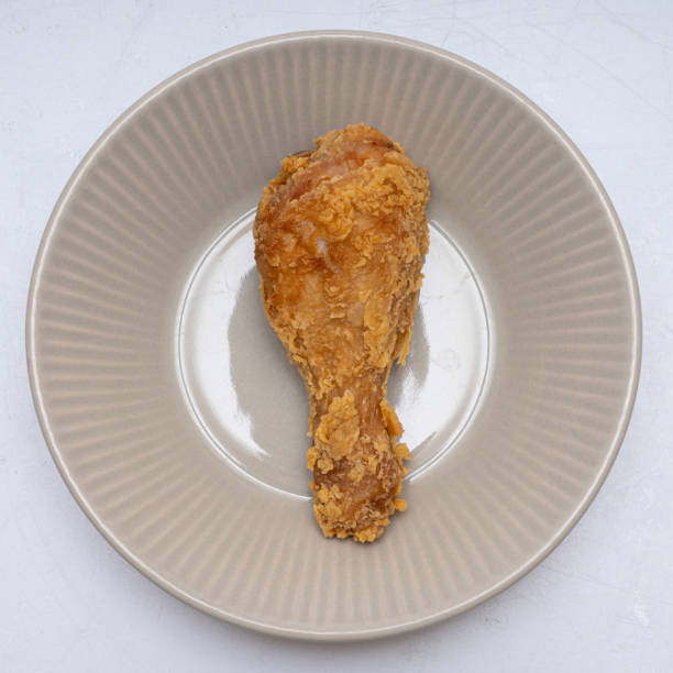 istock Delicious-looking chicken drumsticks and chicken wings 1465989127