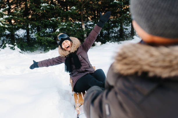 istock boy and girl outdoors on a winter walk playing snowballs 1465991864