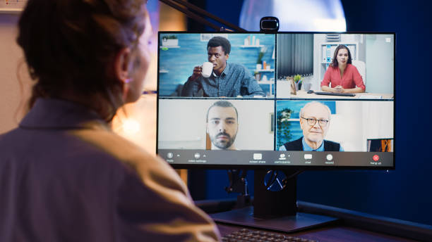 istock Office worker meeting with coworkers on video call 1465992805