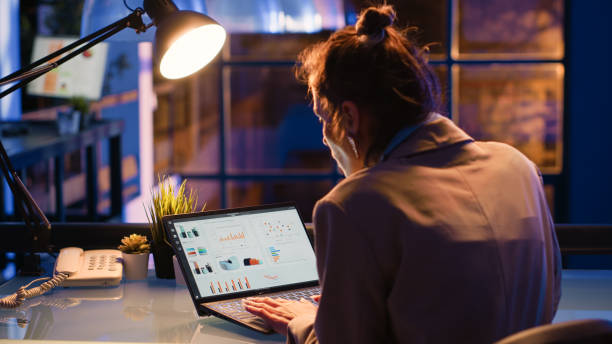 istock Female entrepreneur creating diagrmas at desk 1465993164