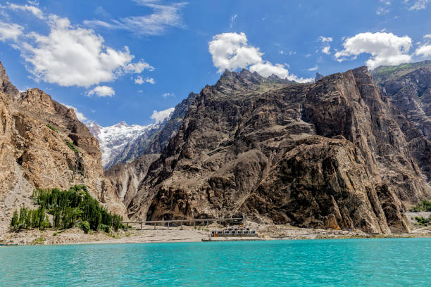 Panoramic view from Attabad lake of Karakoram highway and high mountains Panoramic view from Attabad lake, Karakoram highway passing through tunnel and bridge and high mountains karakoram highway stock pictures, royalty-free photos & images