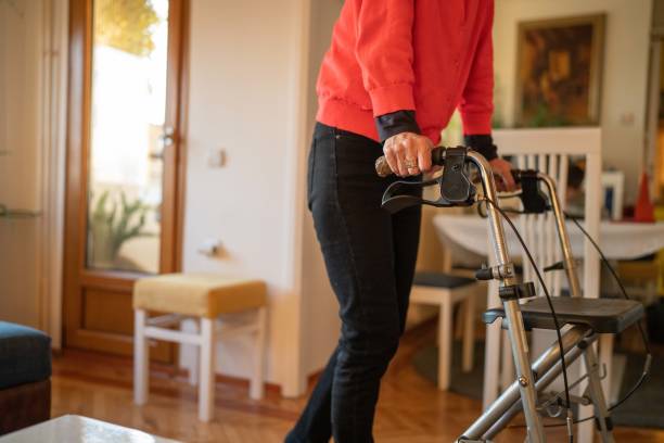 istock Old woman with mobility walker 1466006043