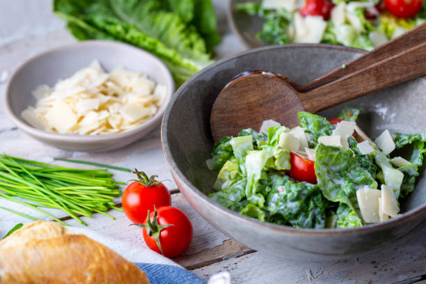 istock Green salad with tomatoes, bread and parmesan cheese 1466008719