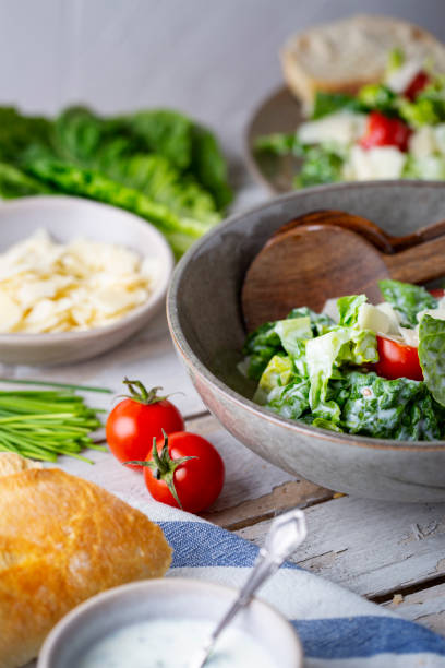 istock Green salad with tomatoes, bread and parmesan cheese 1466008762
