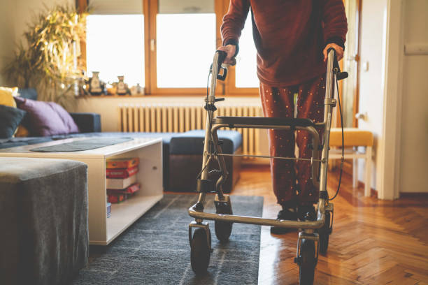 istock Old woman walking with mobility walker 1466019308