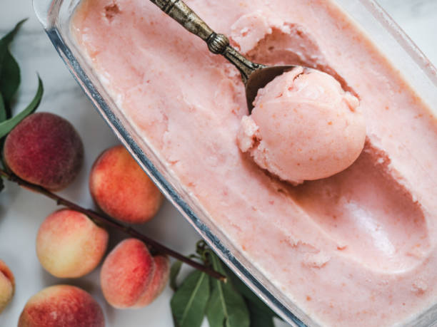 Homemade ice cream and ripe, juicy peaches