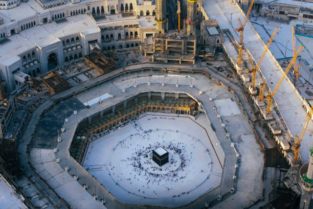 istock Kaaba in Mecca, Muslim people around it 1466035975