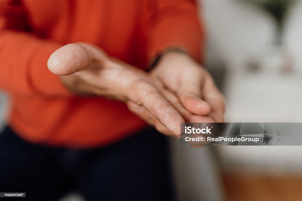 Unrecognizable man massaging his hand Close up unrecognizable man massaging his hand and fingers Hand Stock Photo