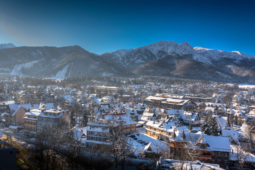 Winter panorama of Zakopane City.  On the background  Tatra Mountains with Giewont Peak. Tatras, Poland..