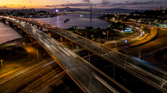 Viaduct with passing car headlights. City of Florianópolis, state of Santa Catarina, southern Brazil.