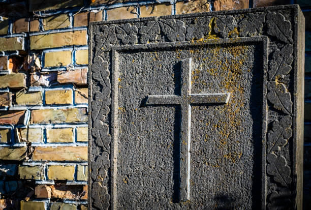 View of an old graveyard, close-up of  marble stone crosses , tombstones. Boisaca, Santiago de Compostela, Galicia, A Coruña province,  Spain.