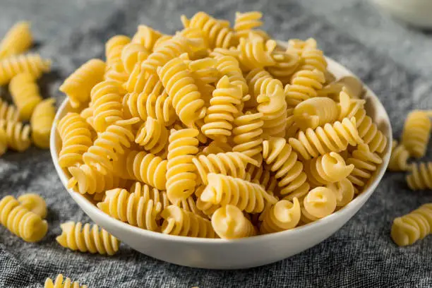 Raw Dry Organic Fusilli Pasta in a Bowl