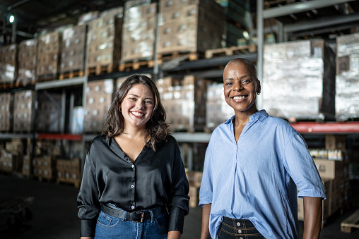 Portrait of female coworkers in a warehouse