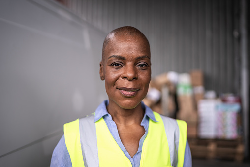 Portrait of a mature woman in a warehouse