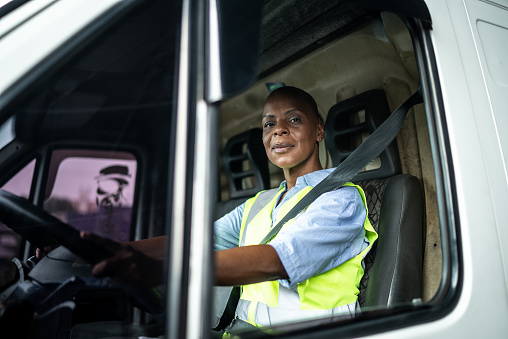 Portrait of a female driver in a truck