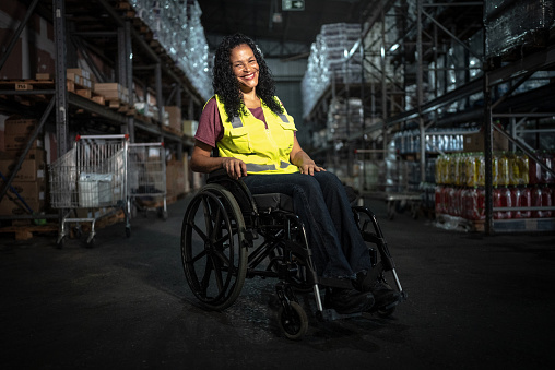 Portrait of a disabled woman in a warehouse