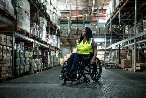 Disabled woman working in a warehouse