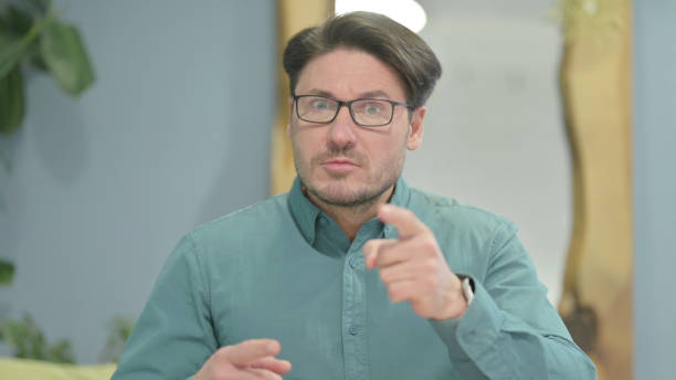 istock Distraught Middle Aged Man Talking in Anger and Stress 1466073446