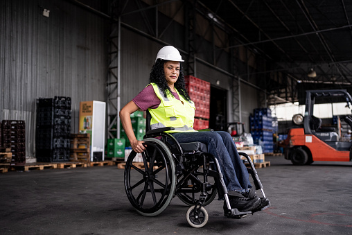 Portrait of a disabled woman in a warehouse