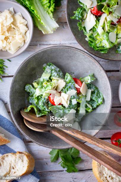Green Salad With Tomatoes Bread And Parmesan Cheese Stock Photo - Download Image Now