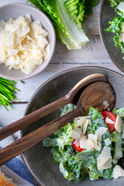 istock Green salad with tomatoes, bread and parmesan cheese 1466099709