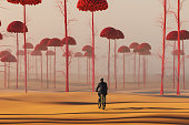 Businessman cycling in strange surreal landscape
