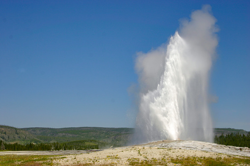 Erupting Old Faithful geyser in Wyoming