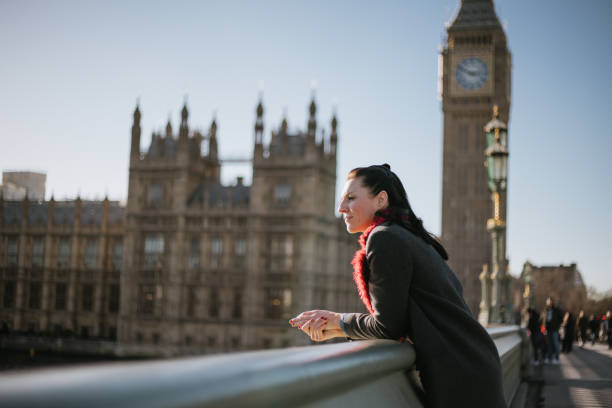 istock Woman having fun on Westminster Bridge 1466115499