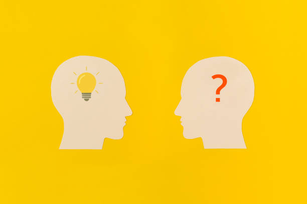 istock Human heads on yellow background 1466115592