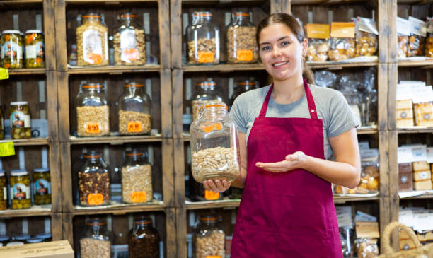istock Young woman holding jar of nuts 1466116265