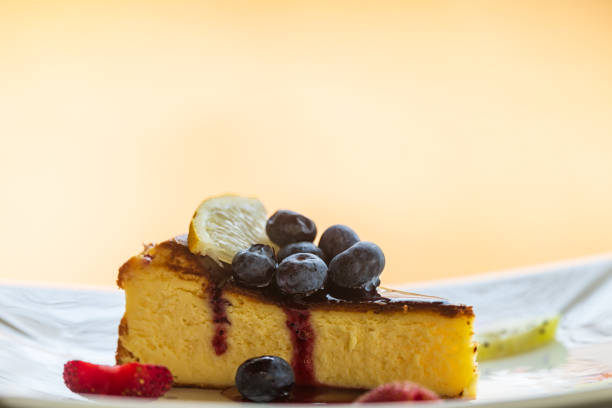 Cheesecakes with fresh berries and strawberry in the plate.