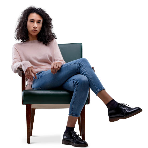 istock Young woman confident, seated, crossing legs 1466135914