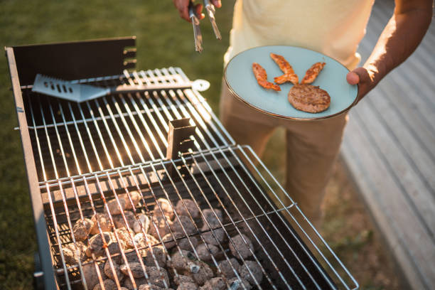 istock Black Male Grilling Meat On A Barbecue Day 1466142479