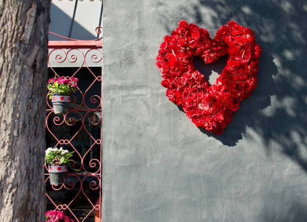 istock Heart shaped wreath on a dark gray wall 1466142492