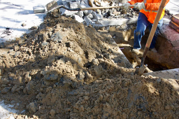 istock Road crew digging a hole to make repairs 1466145545