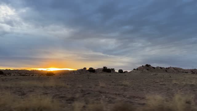 golden desert sunset view out the truck window