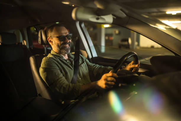 istock Mid aged man driving his car. 1466151632