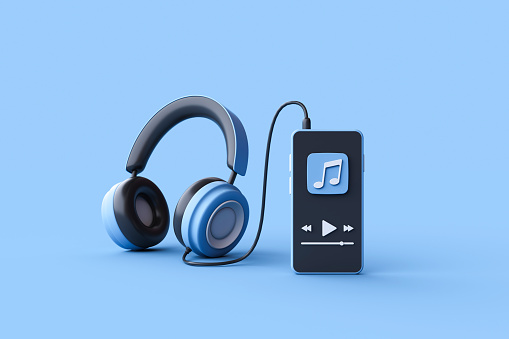 Music player on mobile phone with earphones on black background