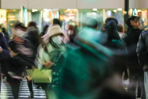 istock Blurred moving groups of people 1466168064