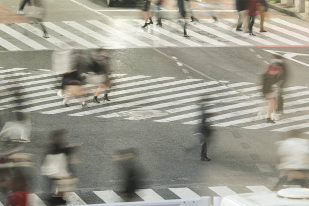 istock Blurred moving groups of people 1466168099