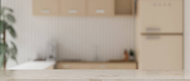istock White kitchen tabletop with empty space over blurred background of minimal white kitchen 1466174368