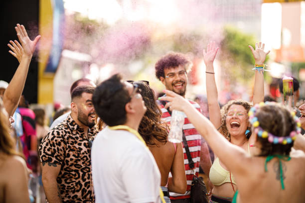 istock Cheerful group of friends celebrating carnival 1466179821
