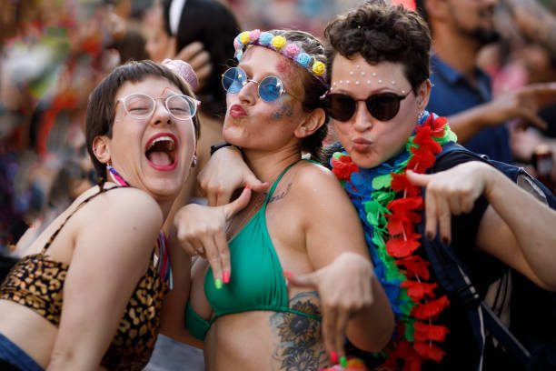 istock Group of friends posing while celebrating carnival party 1466180296